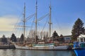 Sailship wuth three masts with white rusty hull mooring in a harbour Royalty Free Stock Photo