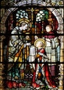 Saint Aloysius is given his first communion by Saint Charles Borromeo
