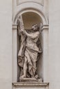 Saint Andrew by Luca Breton on the facade of Santi Claudio e Andrea dei Borgognoni church in Rome, Italy