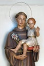 Saint Anthony holds a child of Jesus, a statue in the church of Saint Anthony of Padua in Zagreb, Croatia Royalty Free Stock Photo