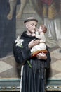 Saint Anthony of Padua holds baby Jesus, statue on the altar of Saint Blaise at Saint Nicholas Church in Gusce, Croatia