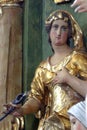 Saint Apollonia, statue on the altar of St. Barbara at St. Peter`s Church in Sveti Petar Mreznicki, Croatia