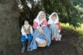 Young girls and little boy dressed as characters from the 17th Century French regime in New France