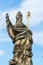 Saint Augustin statue, on Charles Bridge, Prague , The statue depicts a philosopher holding a hook and a burning heart, with an