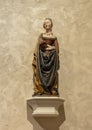 `Saint Barbara`, a limewood with paint statue circa 1490, on display in the Cloisters in New York City.