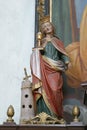 Saint Barbara statue on the altar of Saint Anne in the Church of the Holy Three Kings in Stara Ploscica, Croatia Royalty Free Stock Photo