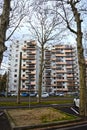 Saint-Etienne, France - January 27th 2020 : Focus on cyan and orange modern buildings with a park Royalty Free Stock Photo