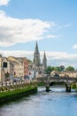 Saint Fin Barre`s Cathedral and south gate bridge on river Lee in Cork