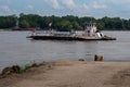 Saint Genevieve, MO--July 3, 2020; Mississippi River crossing ferry boat departs dirt loading ramp to cross over to Illinois from