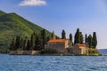 Saint George island with a centuries-old monastery and cemetery and cypress trees in the famous Bay of Kotor, Montenegro