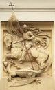 Saint George killing Dragon. Stucco decoration on Art Nouveau bu