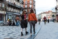 Saint- Gilles, Brussels Capital Region - Belgium Fashionable girls going out at the Parvis market square