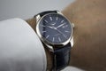Saint-Imier, Switzerland 31.03.2020 - Closeup fashion image of Longines watch on wrist of man Longines man watch