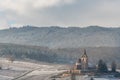 Saint-Jacques-le-Majeur mixed church under the snow near the wine route Royalty Free Stock Photo