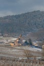 Saint-Jacques-le-Majeur mixed church under the snow near the wine route Royalty Free Stock Photo