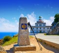 Saint James Way sign and lighthouse of Finisterre Royalty Free Stock Photo