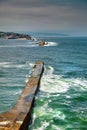 Saint Jean de Luz, France. Basque country. City views Ciboure and Castle and port of Socoa. Ocean waves breaking about the dam