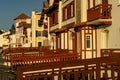 SAINT JEAN DE LUZ, FRANCE - SEPTEMBER 04, 2022: Traditional Basque houses in Jacques Thibaud walk in front of Big beach at sunset