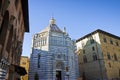 Saint John`s baptistery in Pistoia city built in the year 1303 with an octagonal base - On the left the Episcopal Palace Tuscany