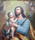 Saint Joseph holding baby Jesus Royalty Free Stock Photo