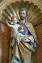 Saint Joseph holding child Jesus Royalty Free Stock Photo