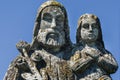 Saint Joseph with little Jesus Christ. Very ancient stone statue.  Fragment Royalty Free Stock Photo