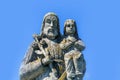 Saint Joseph with little Jesus Christ. Very ancient stone statue Royalty Free Stock Photo