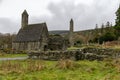 Saint Kevin`s Kitchen and the Round Tower at the Glendalough Monastic Site in Wicklow, Ireland