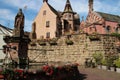 saint-lÃ©on fountain, saint-lÃ©on-pfalz castle and saint-lÃ©on-IX chapel - eguisheim - france Royalty Free Stock Photo