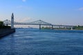 Montreal, Quebec, Clock Tower and Jacques Cartier Bridge over the Saint Lawrence River, Canada Royalty Free Stock Photo