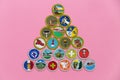 Pyramid of merit badges on pink