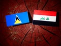 Saint Lucia flag with Iraqi flag on a tree stump isolated Royalty Free Stock Photo