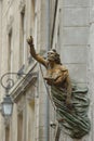 Close-up on a figurehead statue located above Grands Degres Street inside the walled city