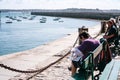 citizens rest on quay in port Saint-Malo town