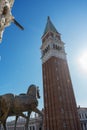 Saint Mark`s Basilica bronze horses and Campanile bell tower Piazza San Marco or Saint Mark`s Square. Royalty Free Stock Photo