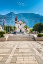 Saint Marko cathedral and church at Makarska city, Croatia. The Biokovo mountains in the background. Sunny day at summer, green Royalty Free Stock Photo