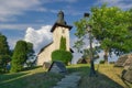 Saint Martinâs Church in Martincek with wooden marquises around during summer sunset