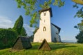 Saint Martinâs Church in Martincek with wooden marquises around during summer sunset