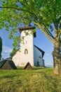 Saint Martinâs Church in Martincek with wooden marquises around during summer sunset