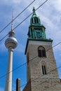 Lutheran Saint Mary`s church in Berlin in contrast with the needle tower of communications