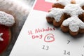 Saint Nicholas Day. Calendar with marked date December 06 and gingerbread cookies, closeup Royalty Free Stock Photo