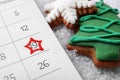 Saint Nicholas Day. Calendar with marked date December 19 and gingerbread cookies on snow, closeup Royalty Free Stock Photo
