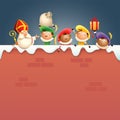 Saint Nicholas or Saint Nicholas and helpers Zwarte Piets on board - happy cute characters celebrate Dutch holidays on snowy wall Royalty Free Stock Photo