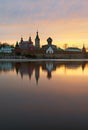 Saint Nicholas Monastery for Men in Staraya Ladoga, view from a bank of Volkhov river at sunset.