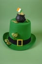 Saint Patrick background. St.Patrick 's Day.Green leprechaun hat,flag of Ireland,gold coin, bunch of clovers on a green