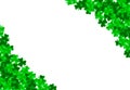 Saint Patrick day background with green bright leaves of trefoil clover in corners.