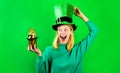 Saint Patrick day celebration. Blonde woman in green sweater and leprechaun hat. Patricks day. Happy girl in green Royalty Free Stock Photo