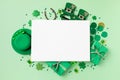 Saint Patrick Day green background with hat, shamrock clover with gifts. Festive greeting card