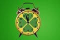 Saint Patrick\'s Day. Alarm clock close-up on a green background