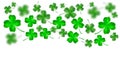 Saint Patrick`s Day backdrop template. Abstract bright and blurry luck clovers isolated on white background.